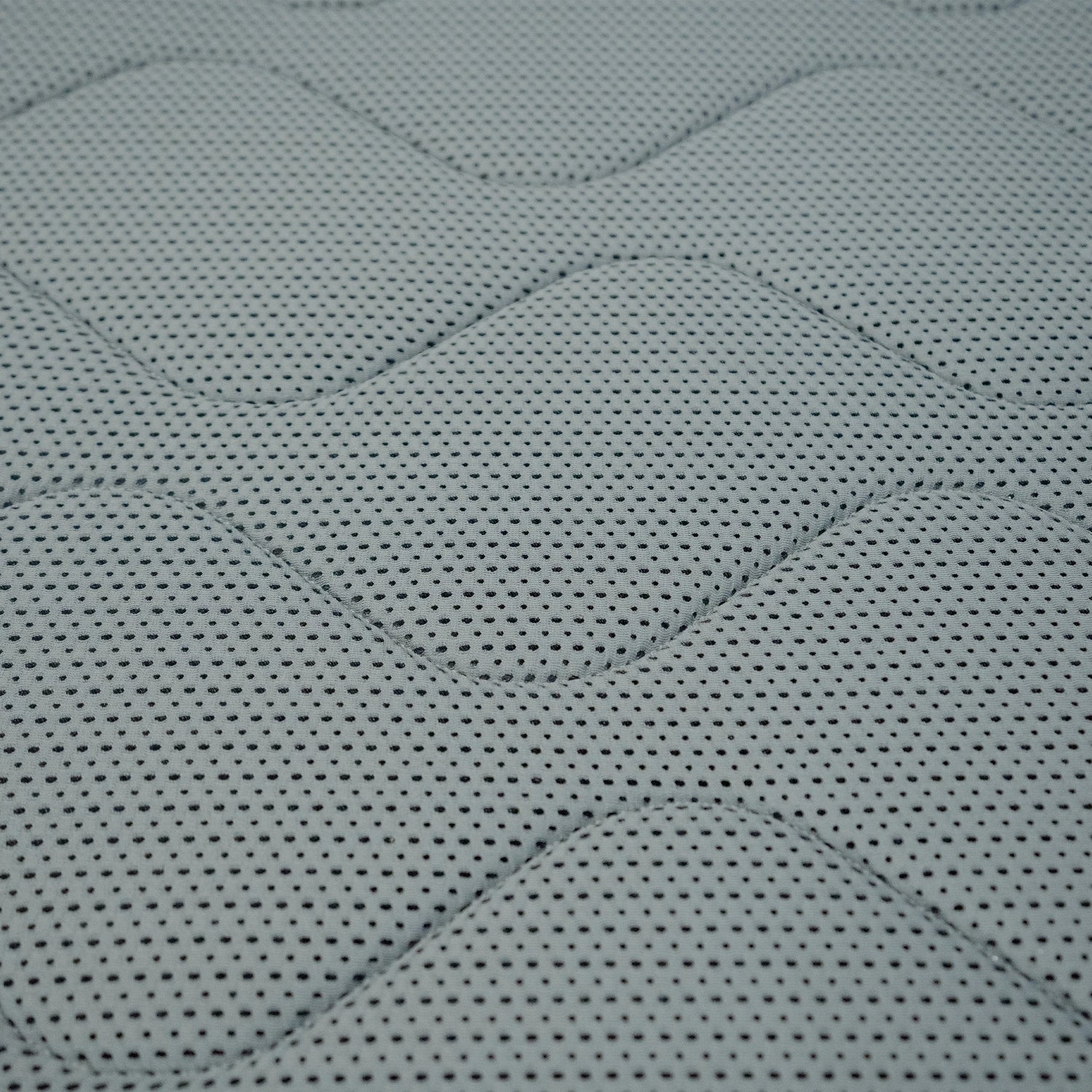 Rolls of mattress quilt fabric in a manufacturing facility, showcasing high-quality materials used for durable and comfortable bedding products