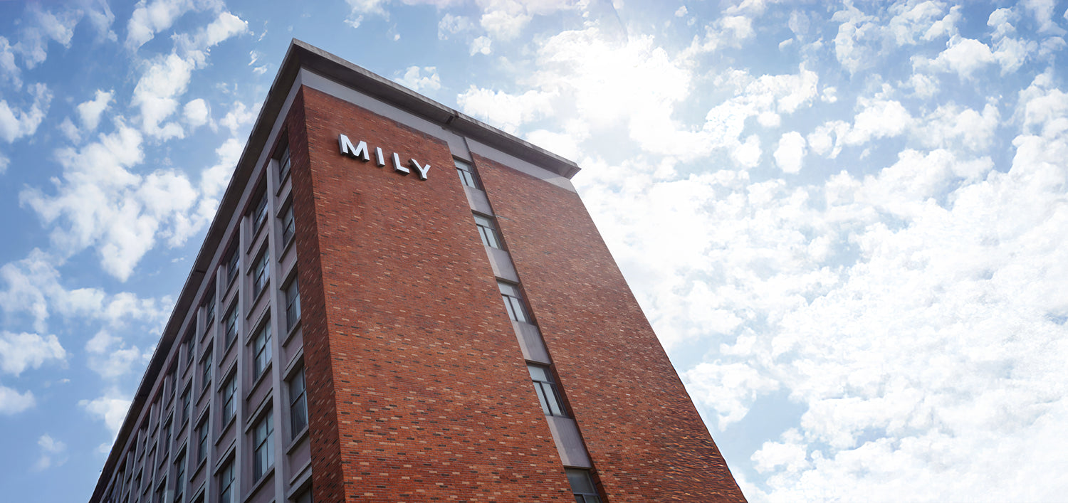 Mily factory office exterior with the prominent Mily logo, showcasing our strength, professionalism, and commitment to quality in mattress manufacturing.