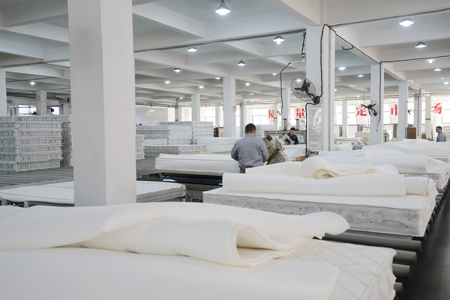 Mily Mattress Factory with skilled workers in action, demonstrating our commitment to quality and craftsmanship in mattress production.